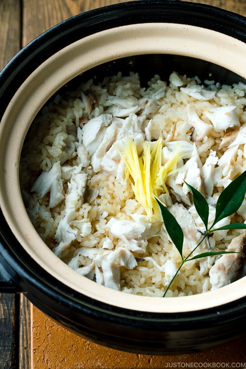 A Kamadosan (Japanese donabe) containing Tai Meshi (Japanese Sea Bream Rice) garnished with julienned ginger.