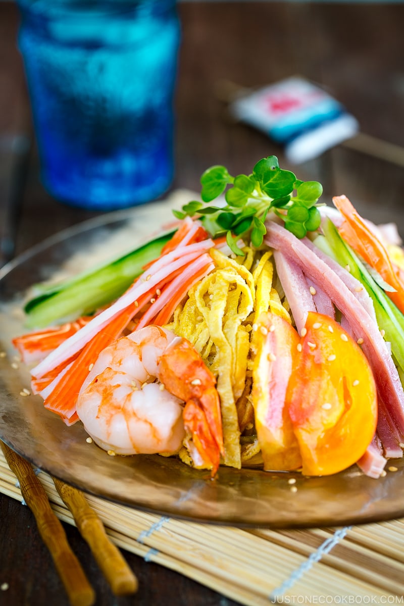 A glass plate containing Hiyashi Chuka (Cold Ramen).