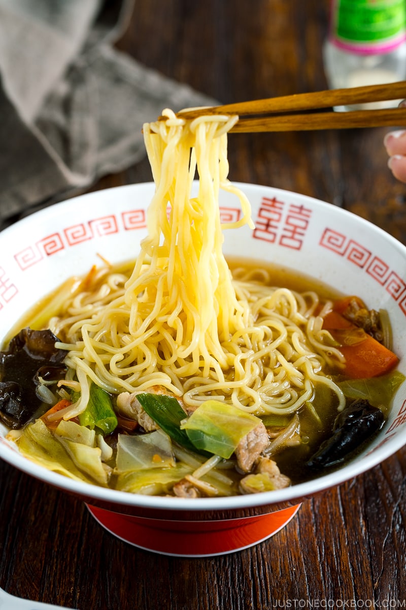 A ramen bowl containing tan men.