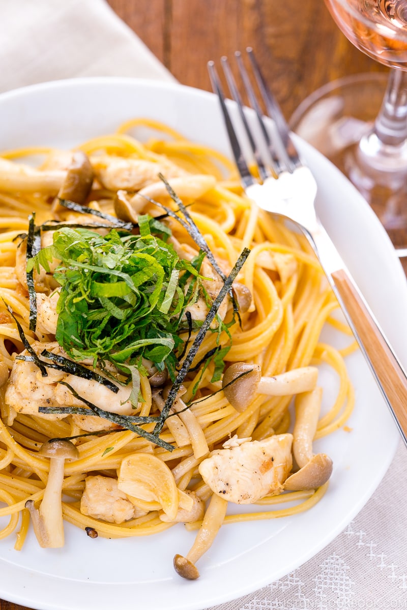 A white plate containing ume shiso pasta.