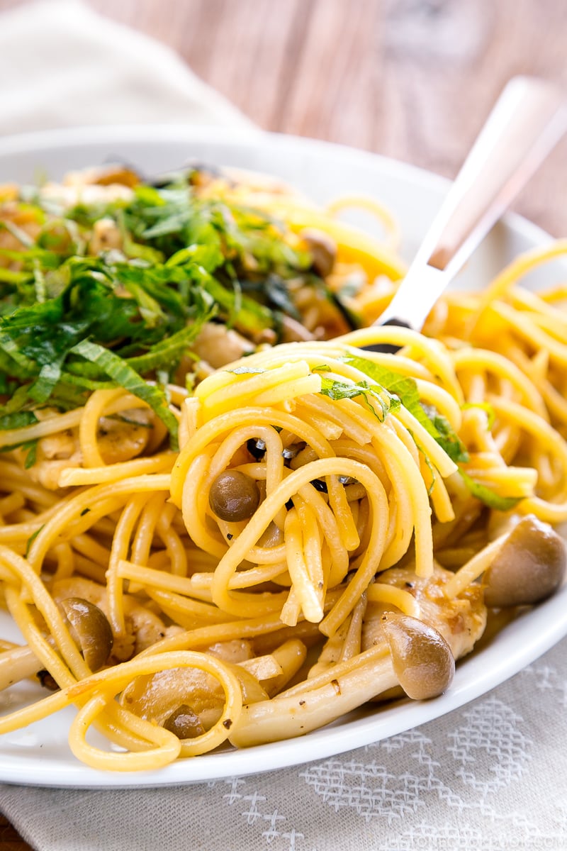 A white plate containing ume shiso pasta.