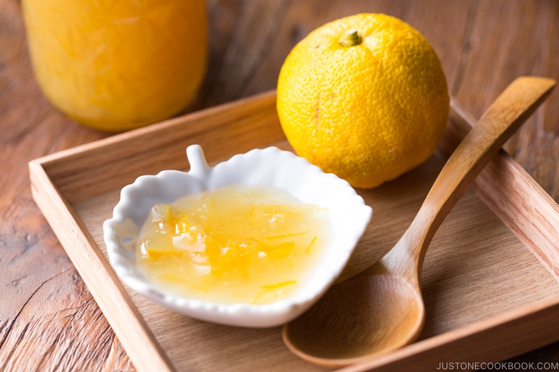 Yuzu marmalade in a white plate.