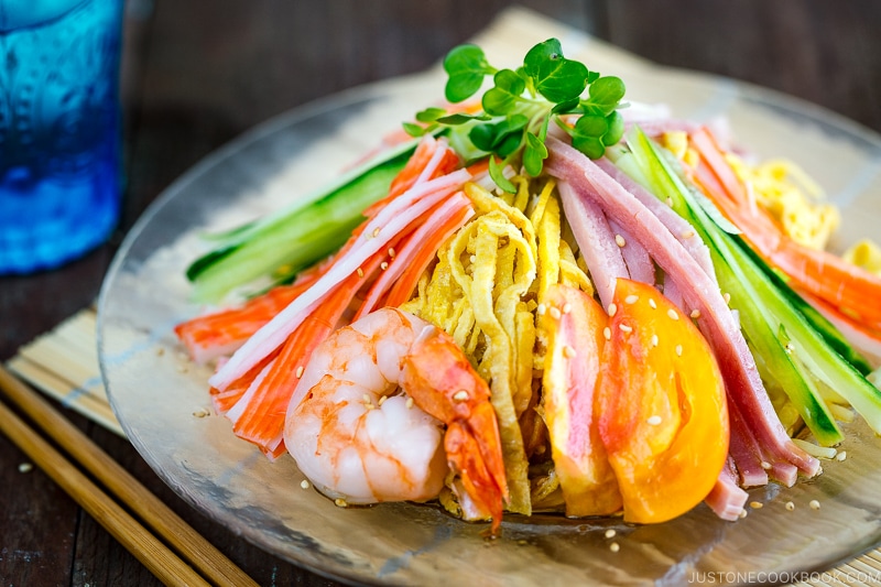 A glass plate containing Hiyashi Chuka (Cold Ramen).