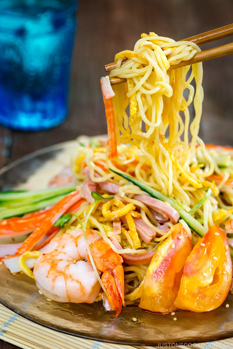 A glass plate containing Hiyashi Chuka (Cold Ramen).