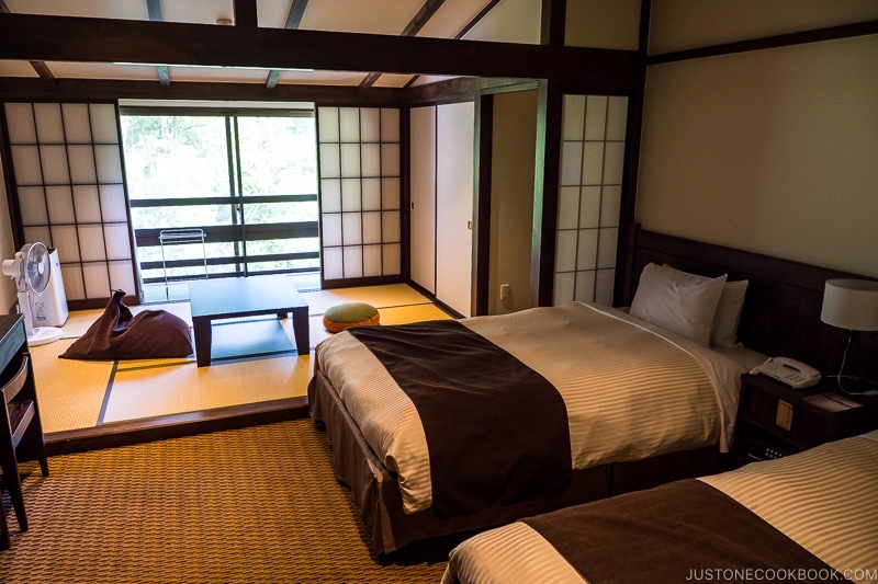 guest room at Kamikochi Alpen Hotel with two beds and tatami sitting area