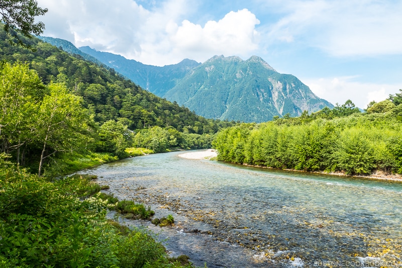 Azusa River with clear water and trees and mountains in the background