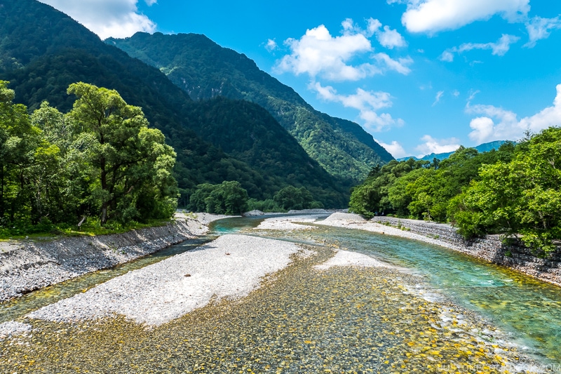 view of Azusa River with rocky shores and flowing above rocky riverbed