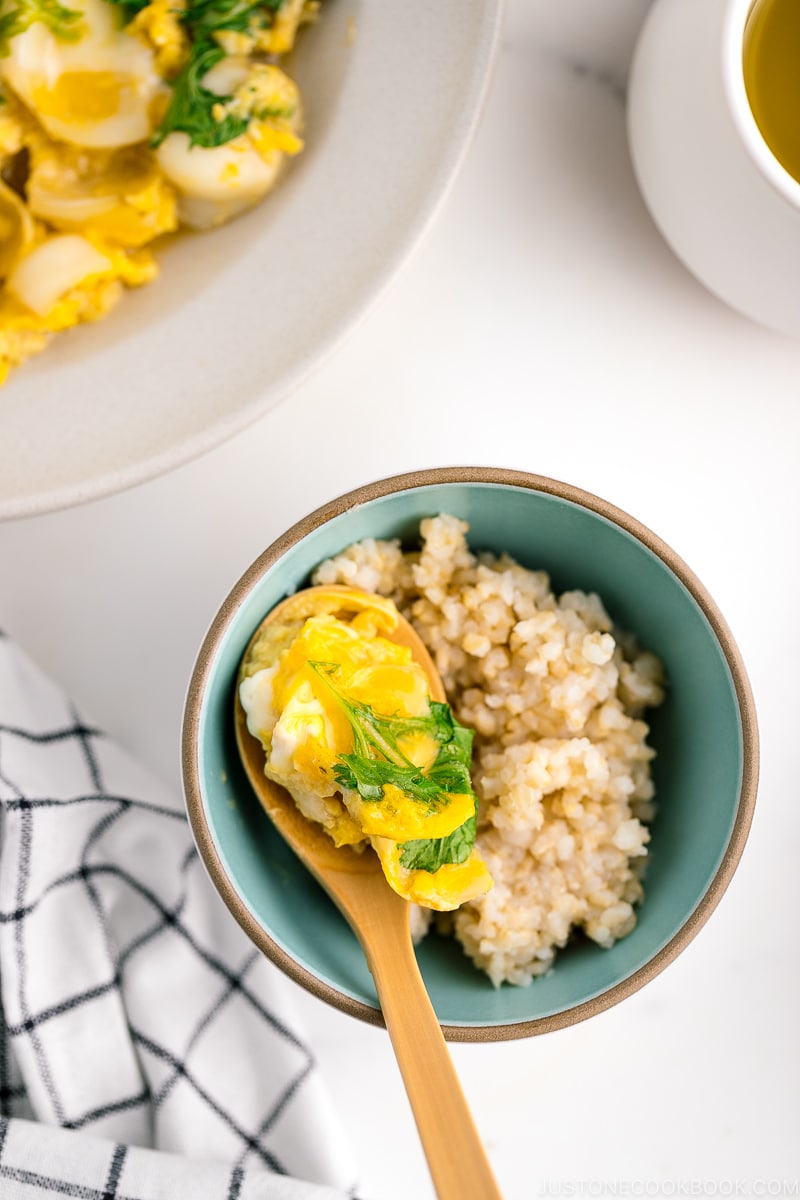 A ceramic dish containing lily bulb tamagotoji over steamed brown rice.