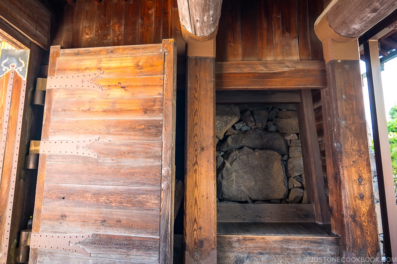 wooden gate with inside of castle wall exposed