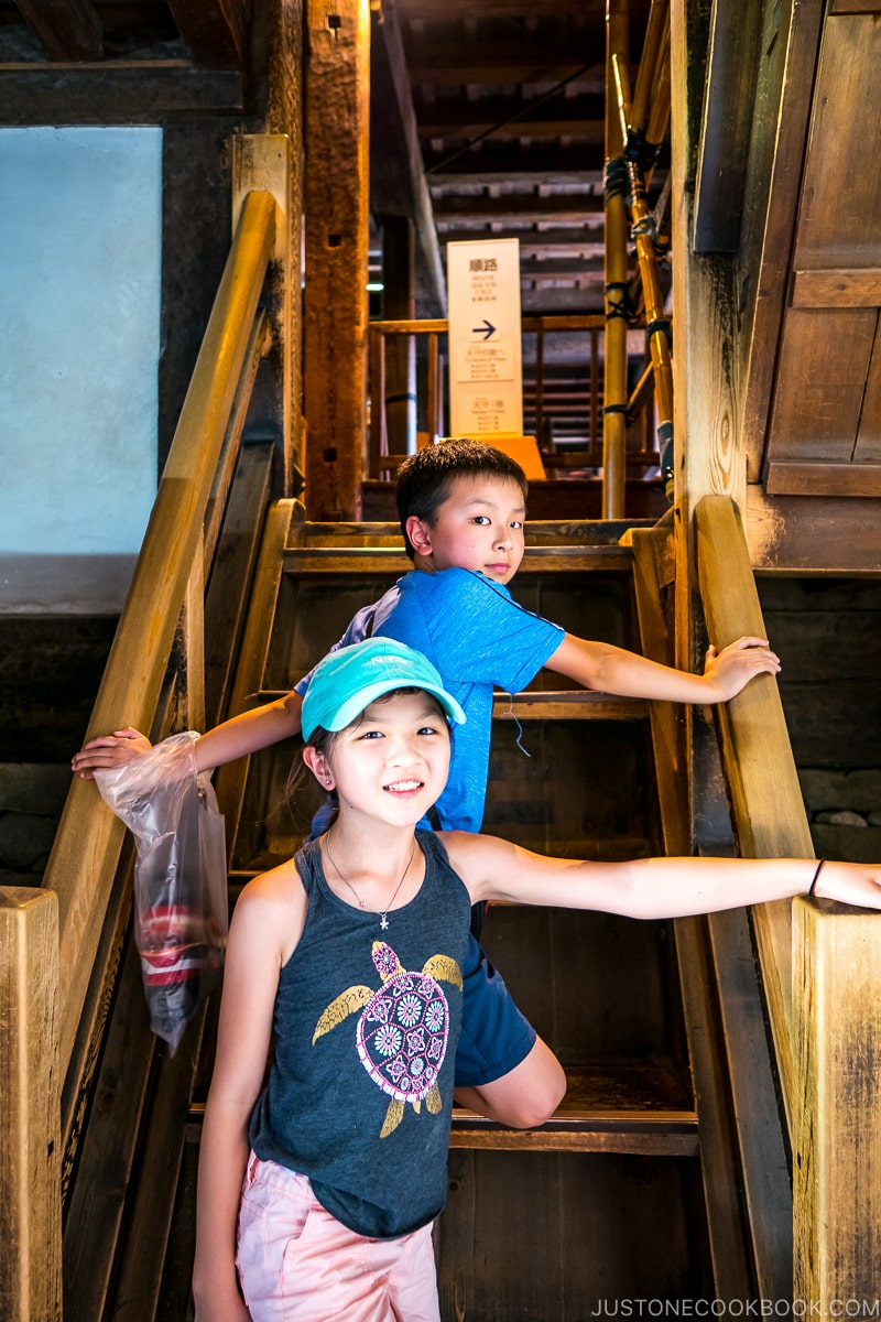 two children on wooden stairs