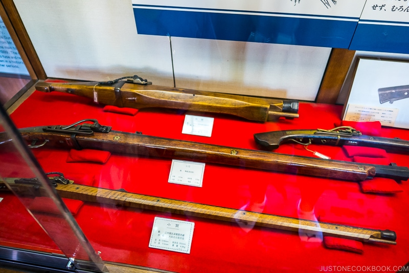 gun in a glass display case