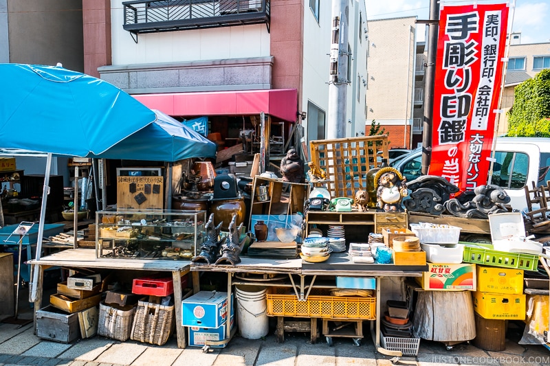 home goods for sale on the side of a shopping street