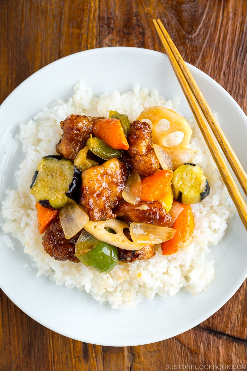 A white plate containing Ootoya’s Sweet and Sour Chicken.