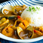 A plate containing Japanese seafood curry made with pressure cooker.