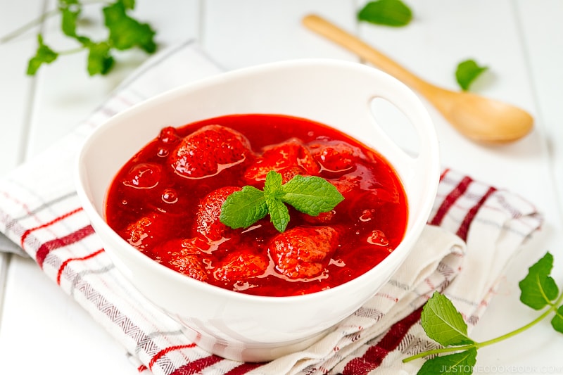 A white bowl containing homemade Strawberry Sauce (Strawberry Compote).