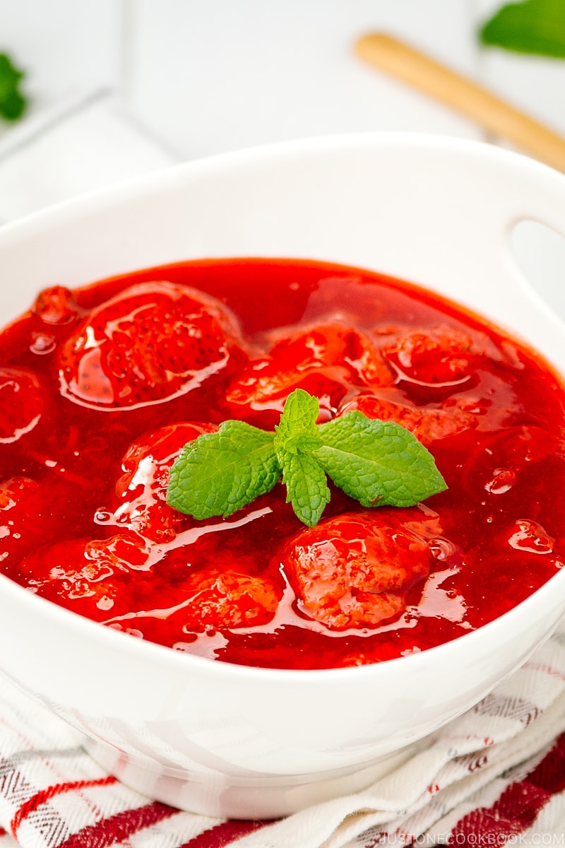 A white bowl containing homemade Strawberry Sauce (Strawberry Compote).