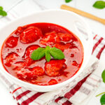 A white bowl containing homemade Strawberry Sauce (Strawberry Compote).