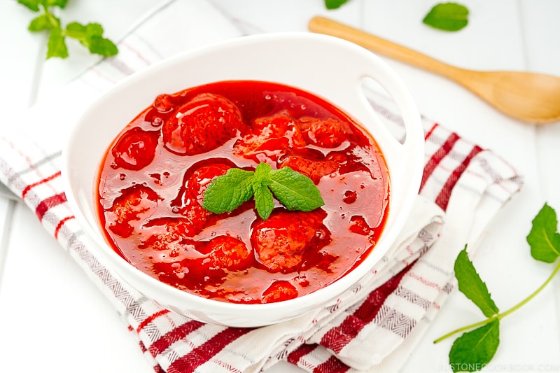 A white bowl containing homemade Strawberry Sauce (Strawberry Compote).