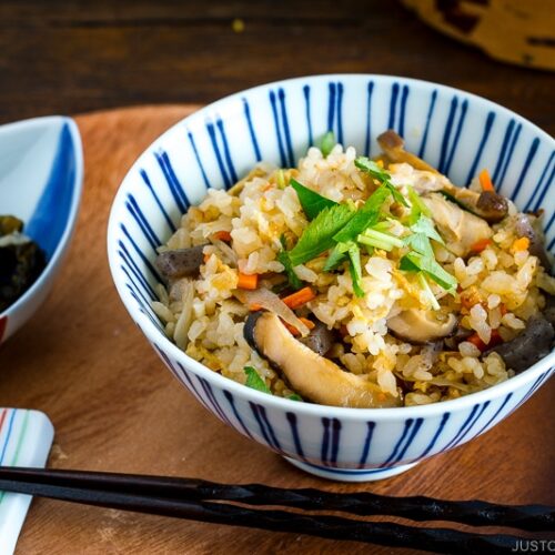 A Japanese blue and white rice bowl containing Takikomi Gohan (Mixed Rice).