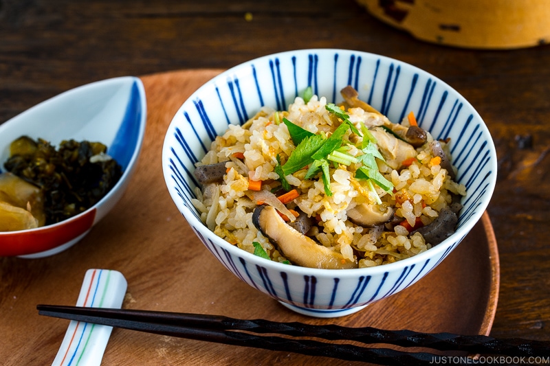 A Japanese blue and white rice bowl containing Takikomi Gohan (Mixed Rice).