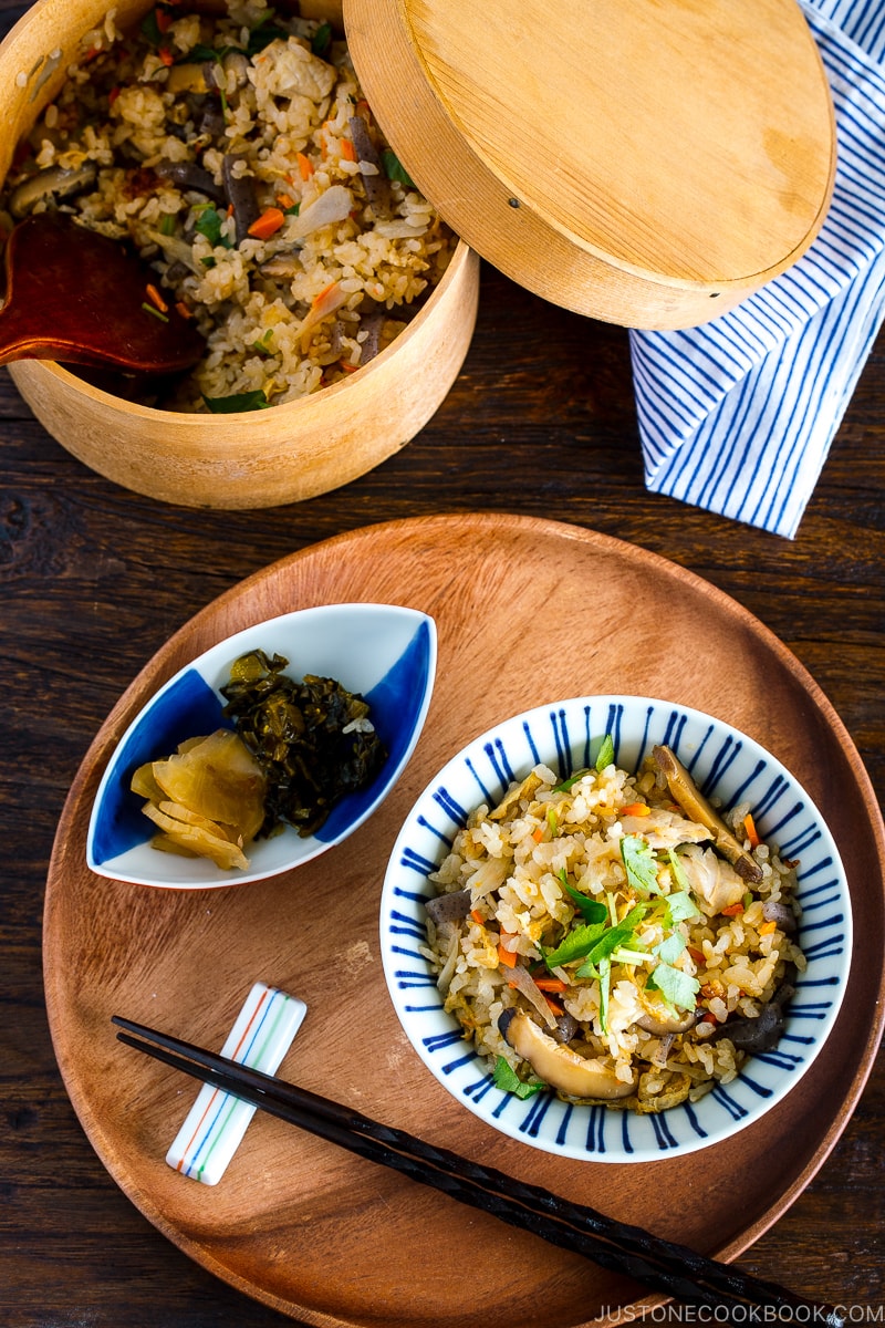 A Japanese blue and white rice bowl containing Takikomi Gohan (Mixed Rice).