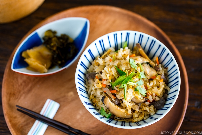 A Japanese blue and white rice bowl containing Takikomi Gohan (Mixed Rice).