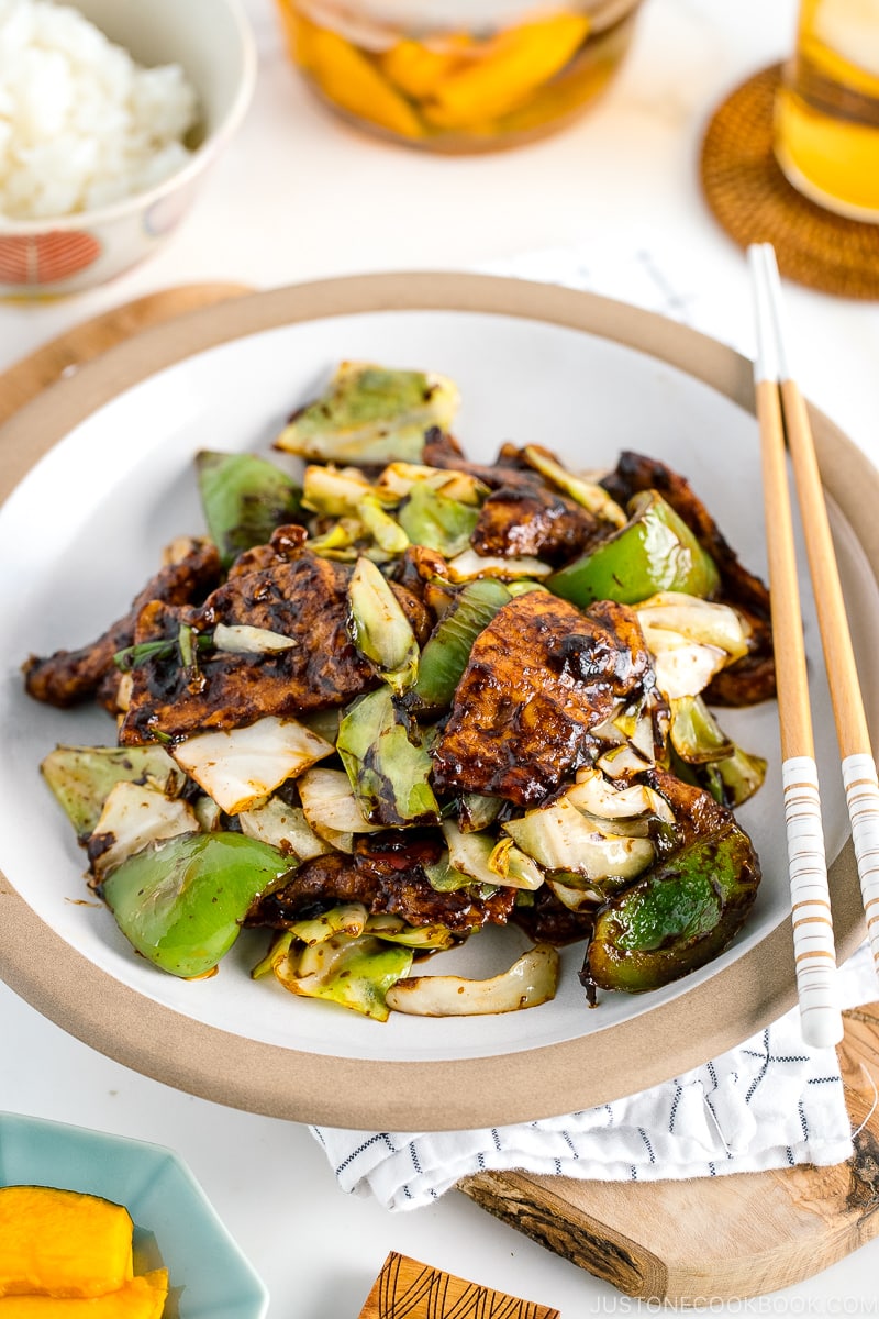 A white ceramic plate containing twice cooked pork.