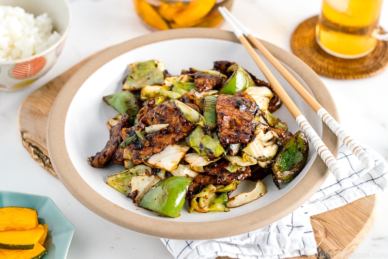 A white ceramic plate containing twice cooked pork.