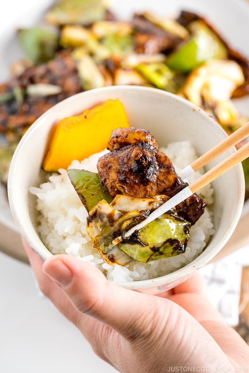 Twice cooked pork is placed on top of steamed rice.