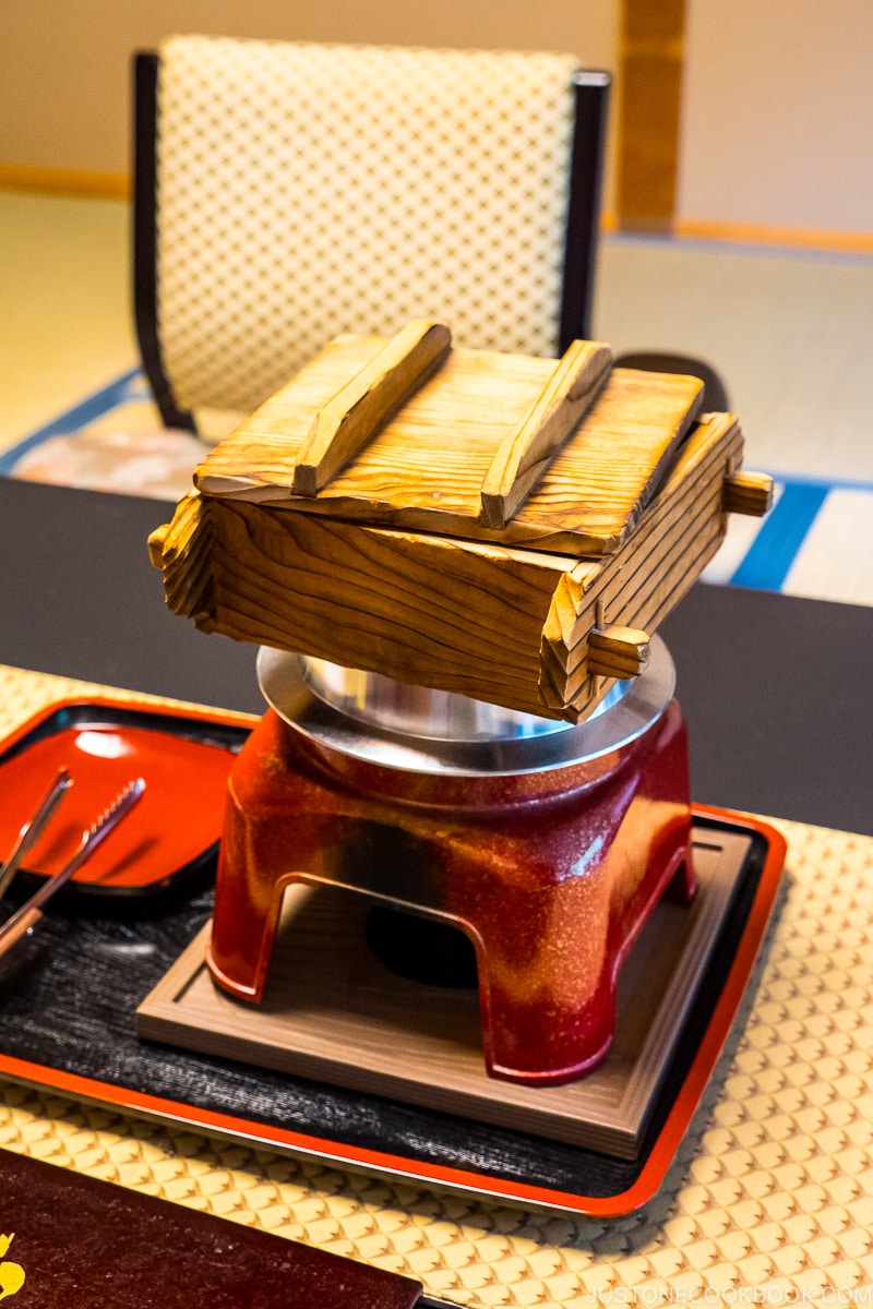 wood steamer on a metal pot on top of table