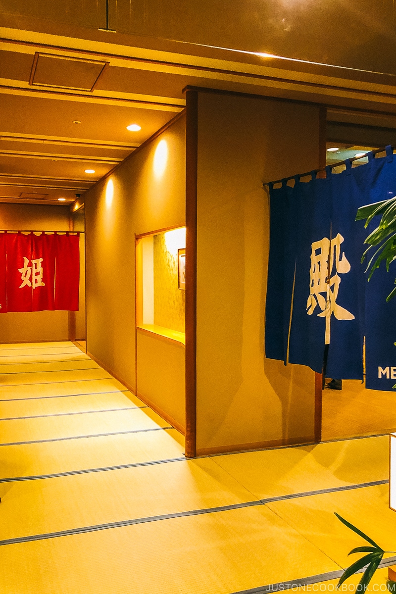 entrance to male and female onsen with tatami walkway