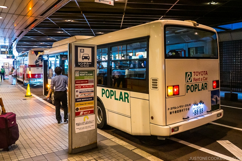 Toyota Rent a Car bus at the curb for Poplar