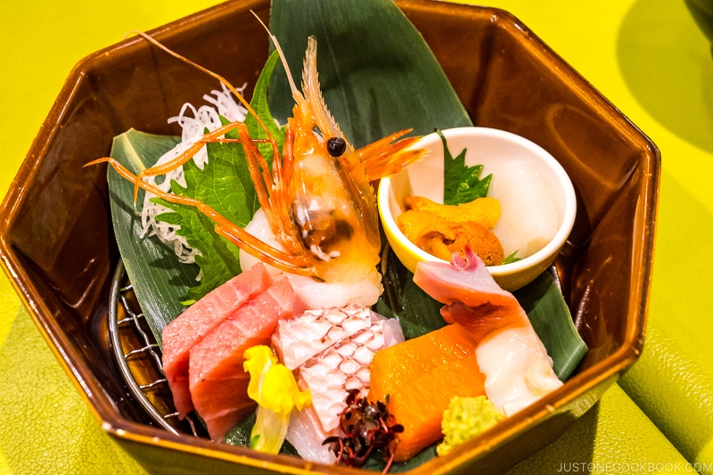 assorted sashimi in a ceramic bowl