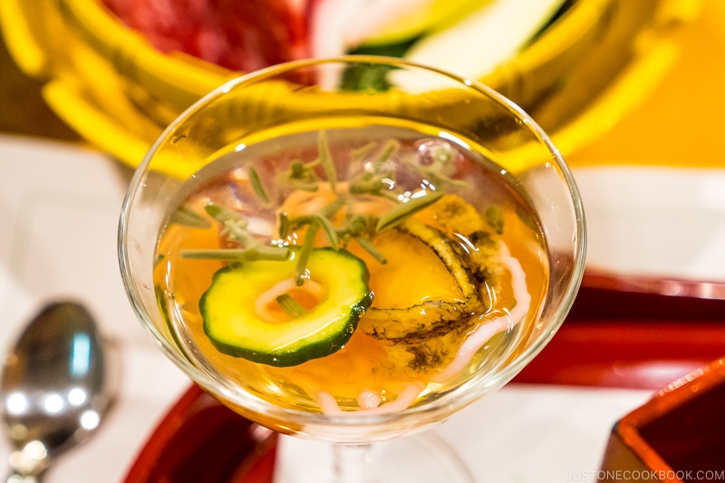 abalone with clear liquid inside a glass