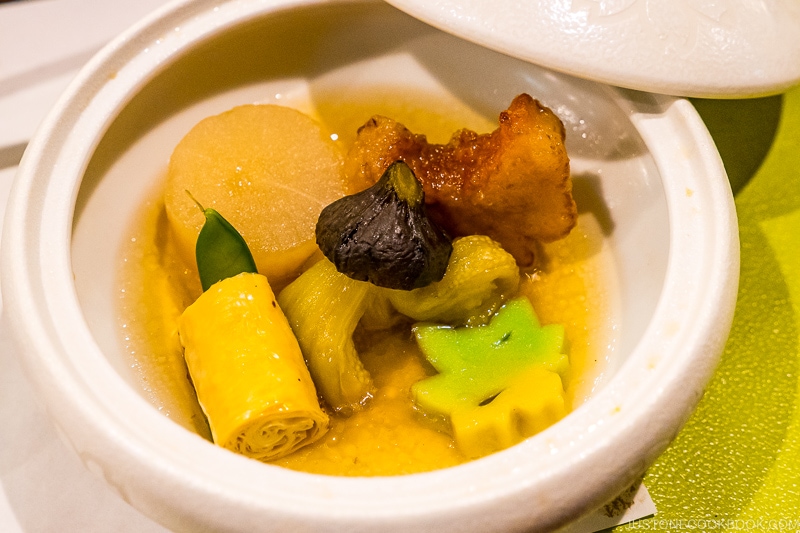 simmered vegetables inside a ceramic bowl