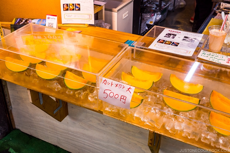 cut yubari melon on ice inside clear case