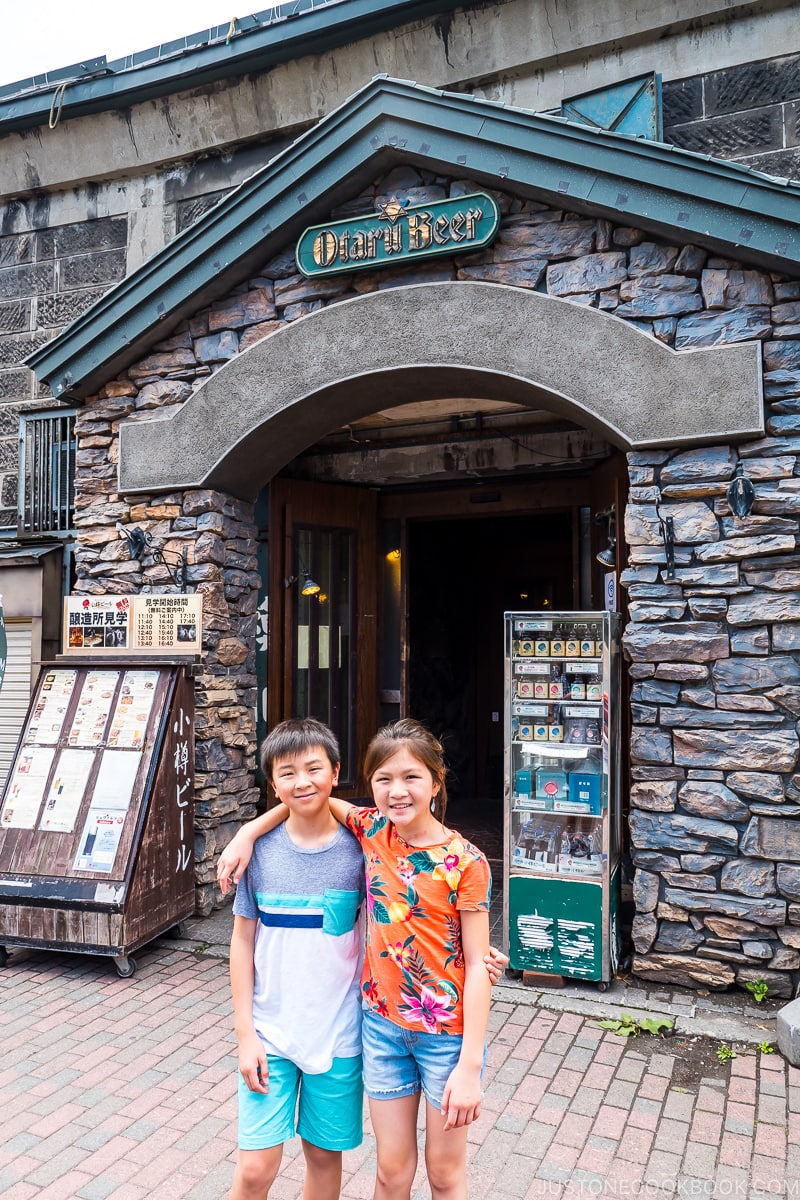 two children standing outside Otaru Beer