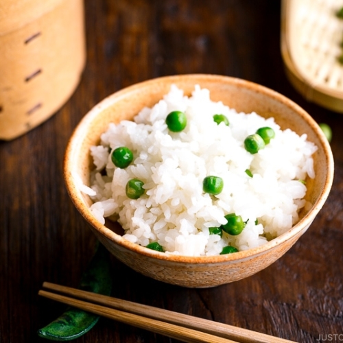 A ceramic rice bowl containing Mame Gohan (Green Pea Rice).