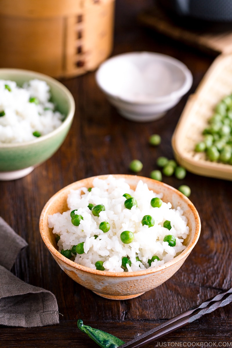 A ceramic rice bowl containing Mame Gohan (Green Pea Rice).