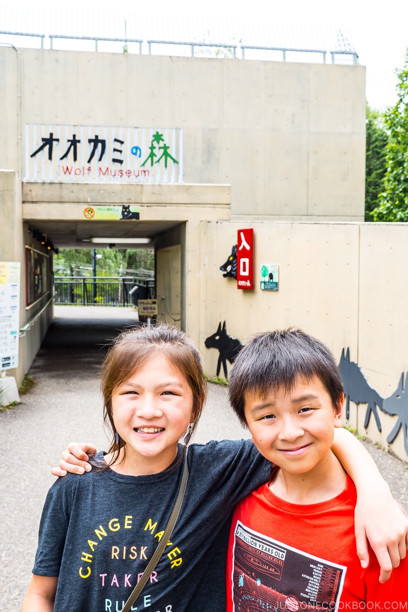 two children in front of the entrance to wolf museum