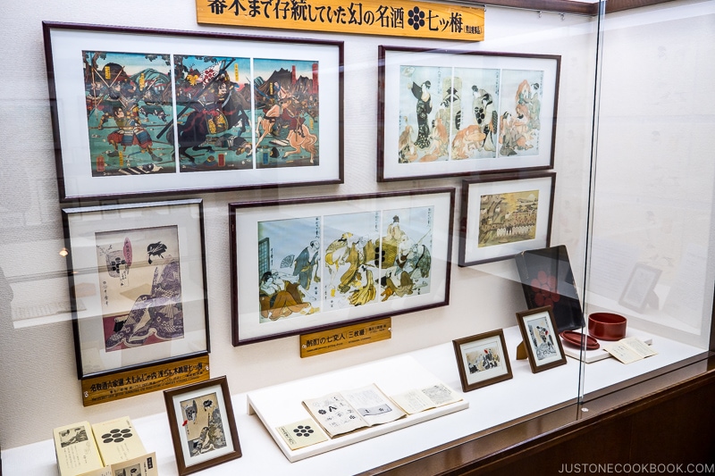 framed Japanese prints in a display case