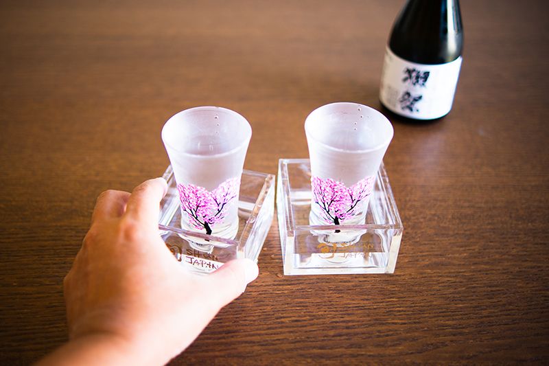 a beautiful set of color changing sakura pattern sake glass