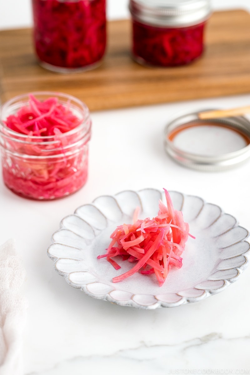 Mason jars containing beni shoga (Japanese red pickled ginger).