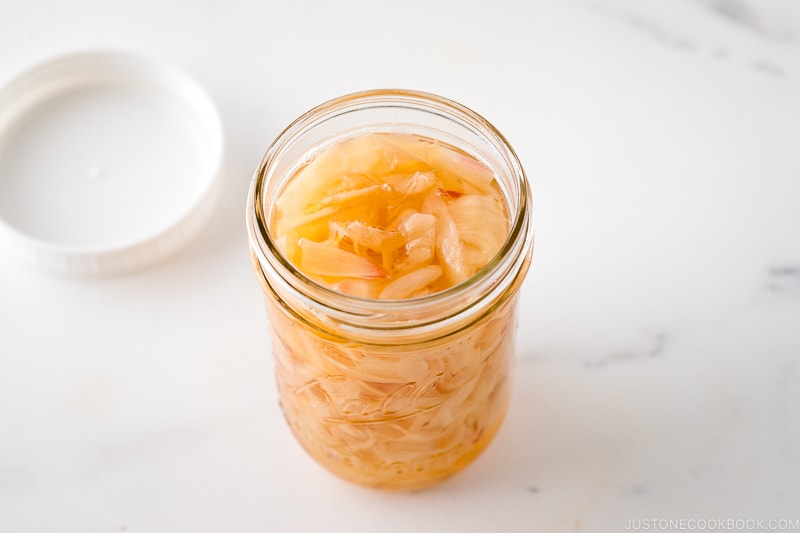 A mason jar containing Pickled Sushi Ginger (Day 1)