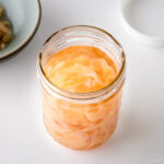 A mason jar containing Pickled Sushi Ginger.