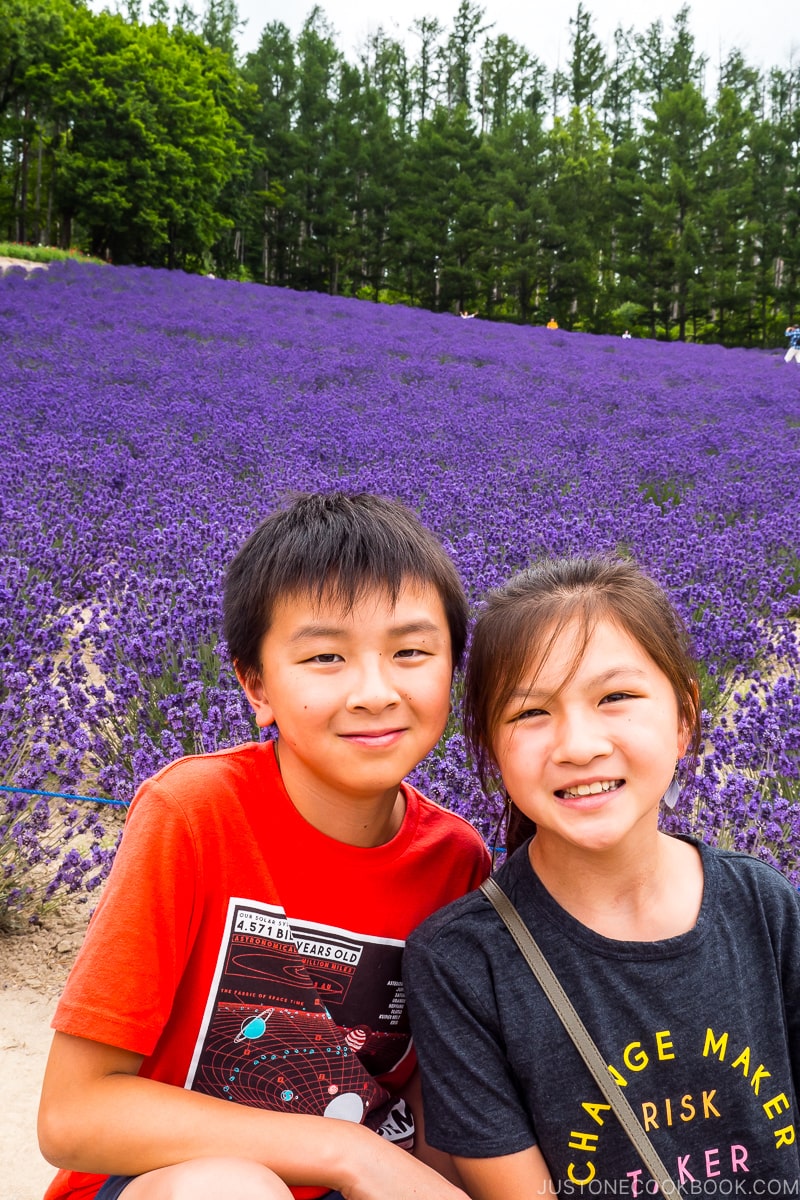 two children in front of a large lavender field