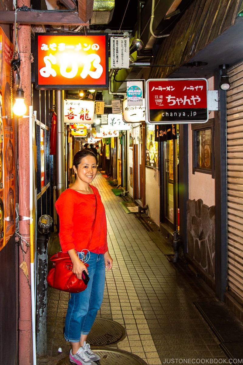 woman standing in Sapporo Ramen Alley