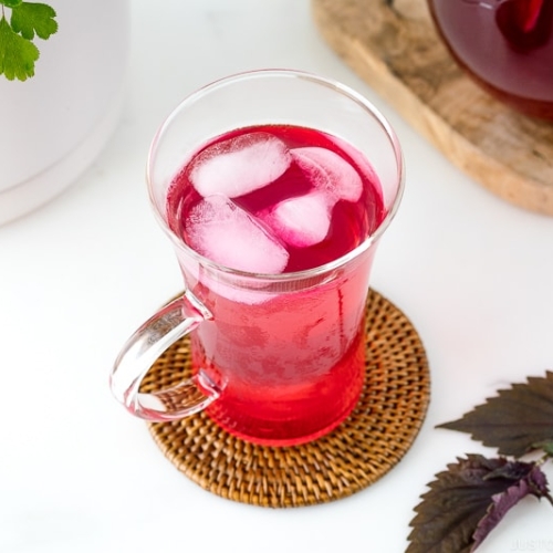 A glass containing Aka Shiso Juice.