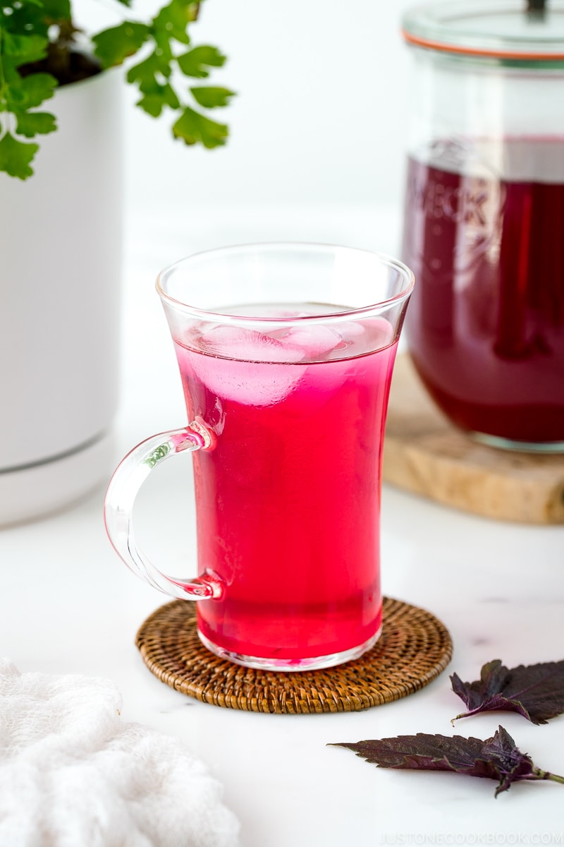 A glass containing Aka Shiso Juice.