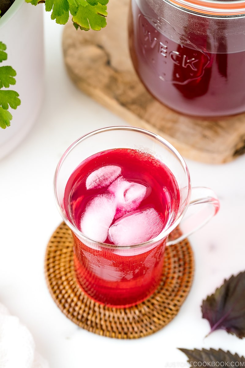 A glass containing Aka Shiso Juice.